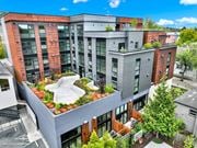 Berkeley apartment for rent - A modern multi-story building with a green roof garden at 26FIFTY Apartments, Berkeley, California