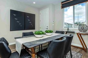 Bakersfield apartment for rent - a dining room with a table and chairs and a large window