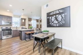 Bakersfield apartment for rent - an open kitchen and dining room with a table and chairs