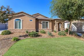 Bakersfield apartment for rent - a house with a lawn and a tree in front of it