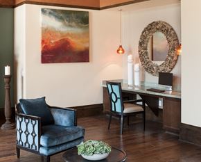 Bakersfield apartment for rent - a clubhouse room with chairs and a computer workspace