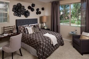 Bakersfield apartment for rent - a bedroom with a bed and flowers on the wall