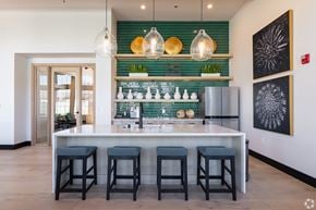 Bakersfield apartment for rent - A bar area with a green tile backsplash and a white counter.