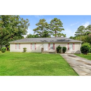 Conley house for rent - a cute white house with red shutters and a green lawn