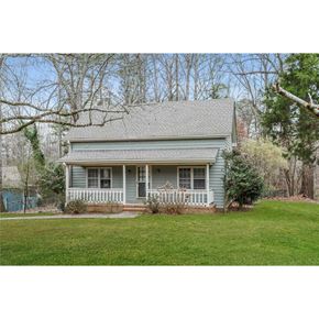 Stone Mountain house for rent - this is a picture of a blue house with a lawn and trees