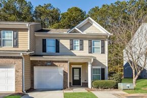 Woodstock townhouse for rent - A two-story house with a garage and a driveway.