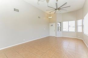 Vail house for rent - A spacious room with a ceiling fan and tile flooring.