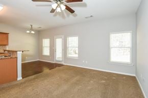 Woodstock townhouse for rent - A room with a ceiling fan and carpeted floor.