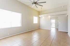 Vail house for rent - A spacious room with a ceiling fan and tile flooring.