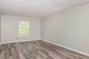 Forest Park house for rent - A room with a window and wooden flooring.