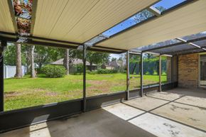 Jacksonville house for rent - A patio with a white roof and a brick wall.