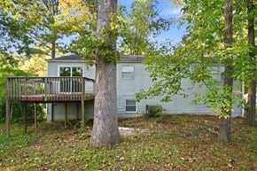 Lithonia house for rent - A house with a deck and a tree in front.