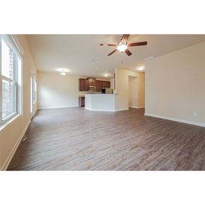 Mcdonough house for rent - A room with a ceiling fan and wooden flooring.