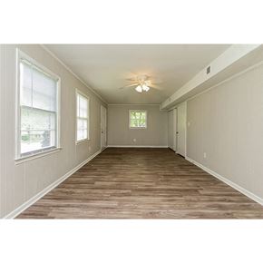 Morrow house for rent - an empty room with a ceiling fan and a window
