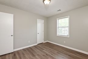 Stone Mountain house for rent - A room with a white door, a window, and a light on the ceiling.