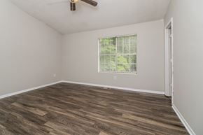 Marietta house for rent - A room with a window and a ceiling fan.