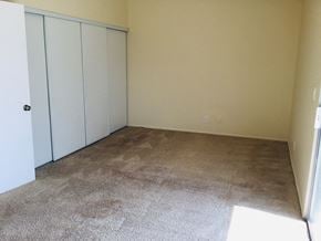 Moreno Valley house for rent - a room with carpet and white closet doors