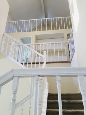 Moreno Valley house for rent - the view down the stairs from the top of a white staircase