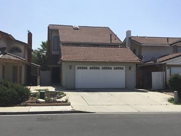 Moreno Valley house for rent - a white garage door in front of a house