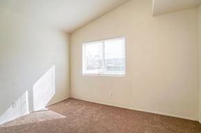 Palmdale house for rent - A room with a carpeted floor and a window.