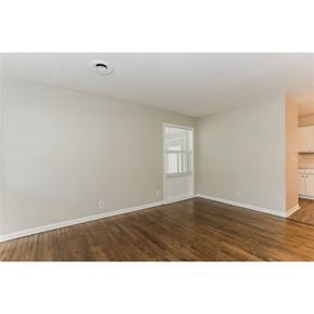 Fairburn house for rent - A room with wooden floors and white walls.