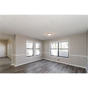 Marietta house for rent - an empty living room with white walls and a window