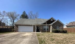 Adairsville house for rent - A house with a grey roof and a white garage door.