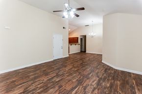 Cartersville house for rent - A room with wooden flooring and a ceiling fan.