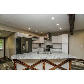 Temple house for rent - a kitchen with a counter top and a refrigerator
