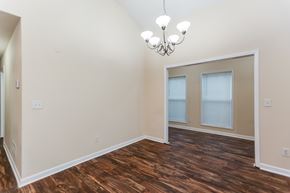 Cartersville house for rent - A room with wood flooring and a chandelier.