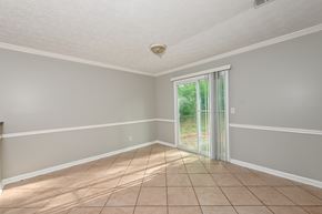 Stone Mountain house for rent - A room with a sliding glass door leading to a garden.