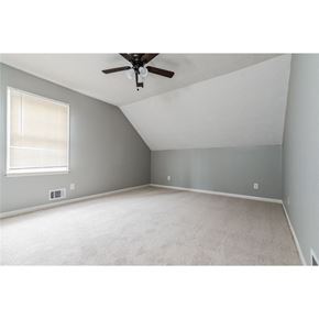 Stone Mountain house for rent - an empty bedroom with a ceiling fan