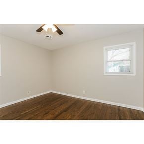 Fairburn house for rent - A room with a ceiling fan and a window.