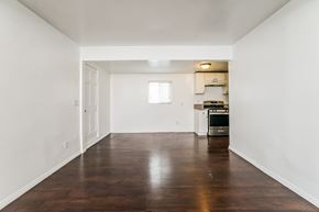 Los Angeles house for rent - A kitchen with white walls and a wooden floor.