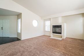 Palmdale house for rent - A living room with a television and a door.