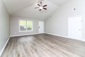 Cartersville house for rent - A room with a ceiling fan and a window with blinds.