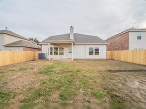 Forney house for rent - A white house with a brown fence in the front yard.
