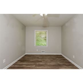Morrow house for rent - a bedroom with a window and a wood floor