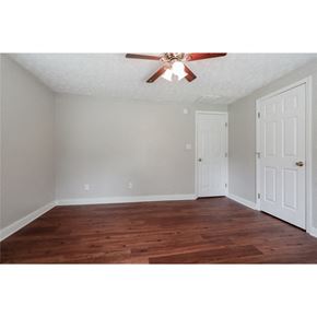 Conley house for rent - a bedroom with a ceiling fan and a closet