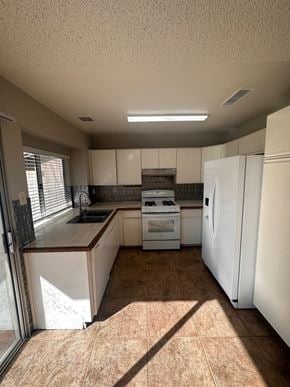Moreno Valley house for rent - an empty kitchen with white appliances and counter tops