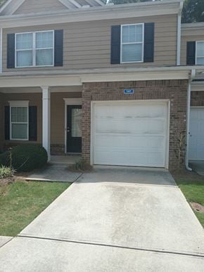 Woodstock house for rent - a white garage door in front of a house