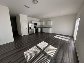 Mcdonough house for rent - an empty living room and kitchen in a new home