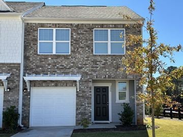 Mcdonough house for rent - the front of a brick house with a black door