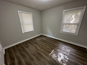 Austell house for rent - an empty room with wooden floors and two windows