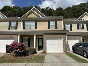 Woodstock house for rent - a home with two garage doors in front of it