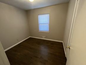 Decatur house for rent - an empty room with wooden floors and a window