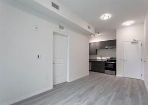 Lakeland apartment for rent - A kitchen with a stove top oven and a refrigerator.