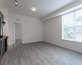 Lakeland apartment for rent - A spacious room with a grey floor and white walls.