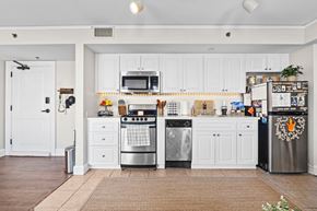 Lakeland apartment for rent - a kitchen with stainless steel appliances and white cabinets