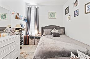 Lakeland apartment for rent - A bedroom with a large bed and a white dresser.